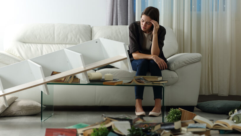 lady in living room after a burglary